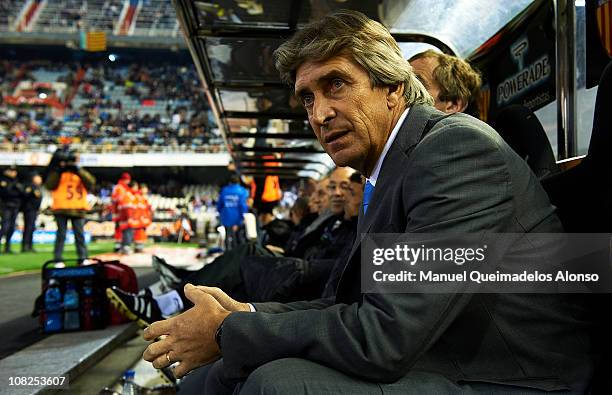 Head coach Manuel Pellegrini of Malaga looks on before the La Liga match between Valencia and Malaga at Estadio Mestalla on January 22, 2011 in...