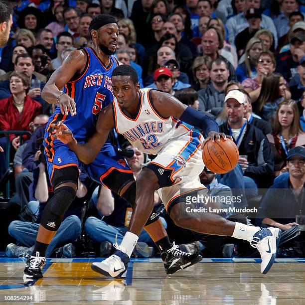 Jeff Green of the Oklahoma City Thunder drives the ball past Bill Walker of the New York Knicks on January 22, 2011 at the Ford Center in Oklahoma...