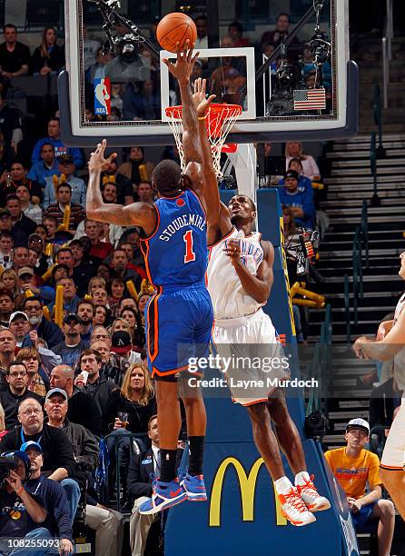 Serge Ibaka of the Oklahoma City Thunder defends Amar'e Stoudemire of the New York Knicks on January 22, 2011 at the Ford Center in Oklahoma City,...