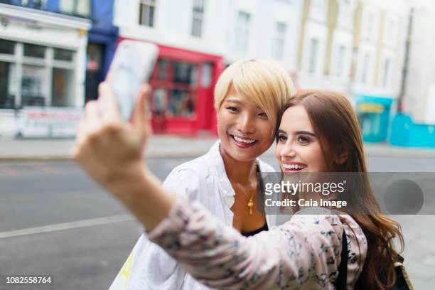 young women friends taking selfie with smart phone on urban street - london 2018 day 2 bildbanksfoton och bilder