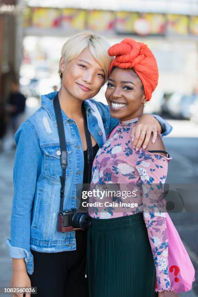 Portrait smiling, confident young women friends hugging