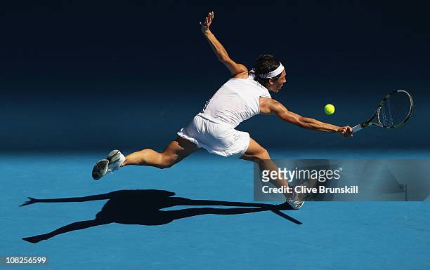 Francesca Schiavone of Italy plays a backhand in her fourth round match against Svetlana Kuznetsova of Russia during day seven of the 2011 Australian...