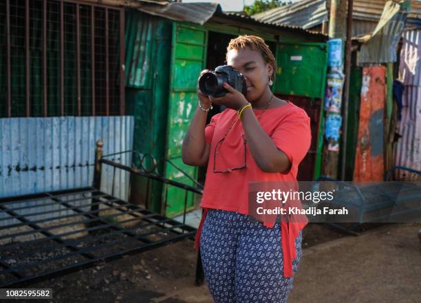 woman photographer on the street - kenya street stock pictures, royalty-free photos & images
