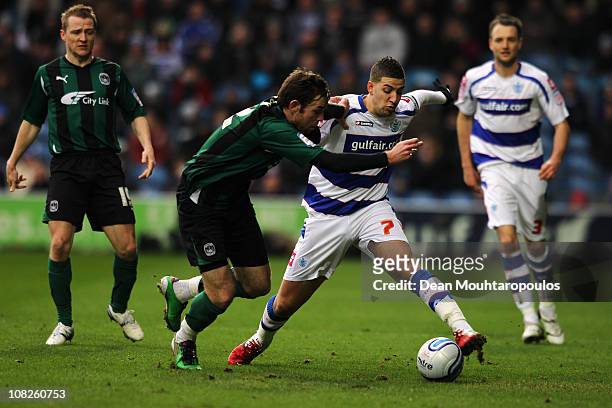 Adel Taarabt of QPR holds off Michael Doyle of Coventry during the npower Championship match between Queens Park Rangers and Coventry City at Loftus...
