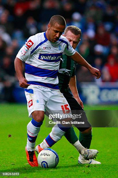 Wayne Routledge of QPR battles for the ball with Sammy Clingan of Coventry during the npower Championship match between Queens Park Rangers and...