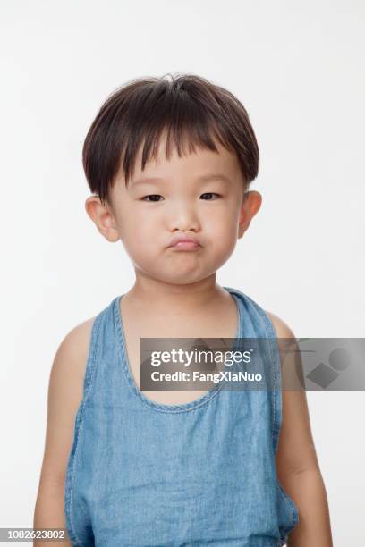 stubborn chinese boy - baby pout stock pictures, royalty-free photos & images