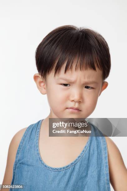 frowning chinese boy - angry babies stock pictures, royalty-free photos & images