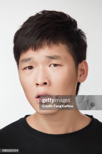 concerned chinese man - clumsy stock pictures, royalty-free photos & images