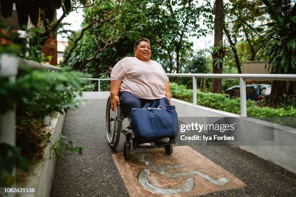 Differently abled Filipino woman going down slope
