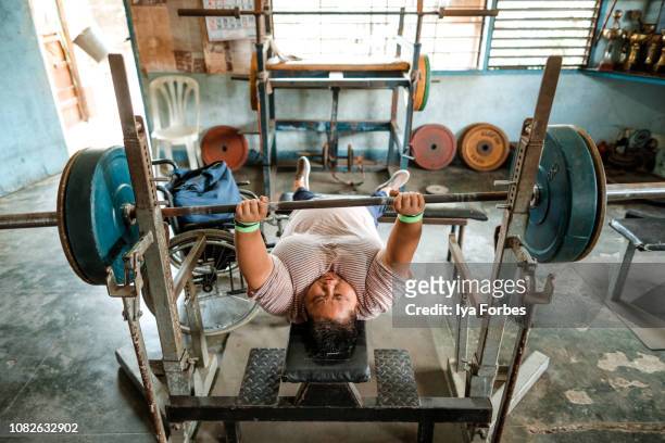 Differently abled Filipino powerlifter training