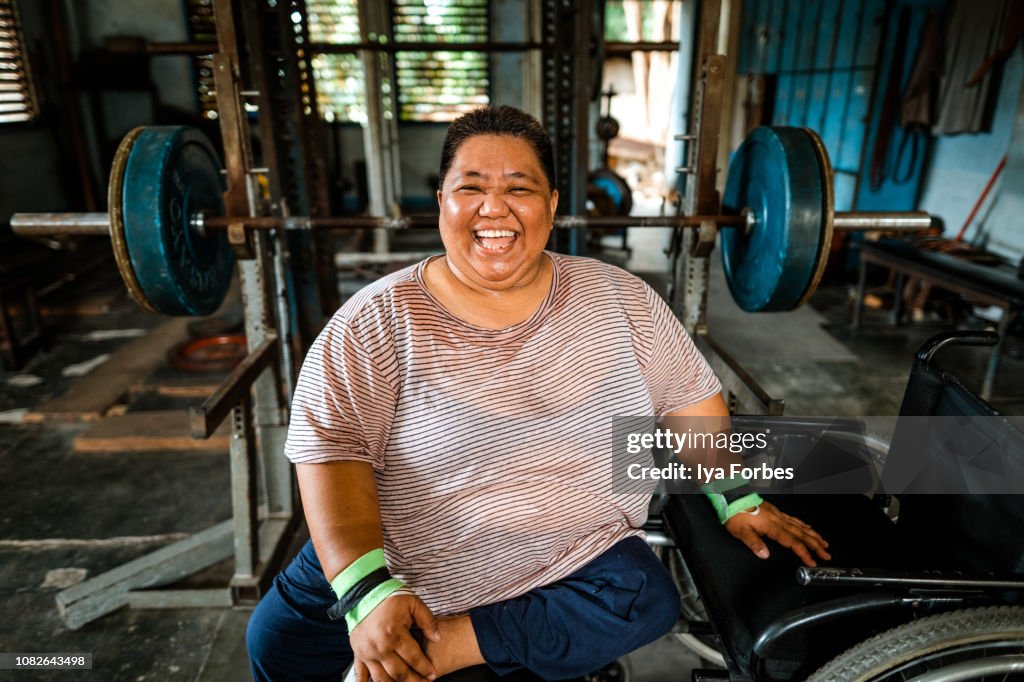 Differently abled Filipino powerlifter smiling