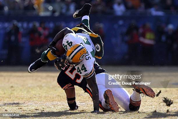 Running back James Starks of the Green Bay Packers runs the ball in the first quarter against Lance Briggs of the Chicago Bears in the NFC...