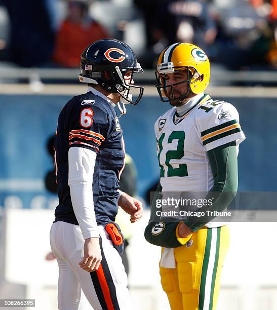 Chicago Bears quarterback Jay Cutler and Green Bay Packers quarterback Aaron Rodgers chat on the field before the start of their NFC Championship...