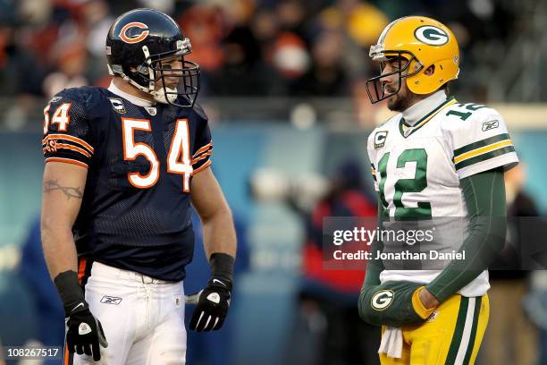 Linebacker Brian Urlacher of the Chicago Bears talks with quarterback Aaron Rodgers of the Green Bay Packers in the second half of the NFC...