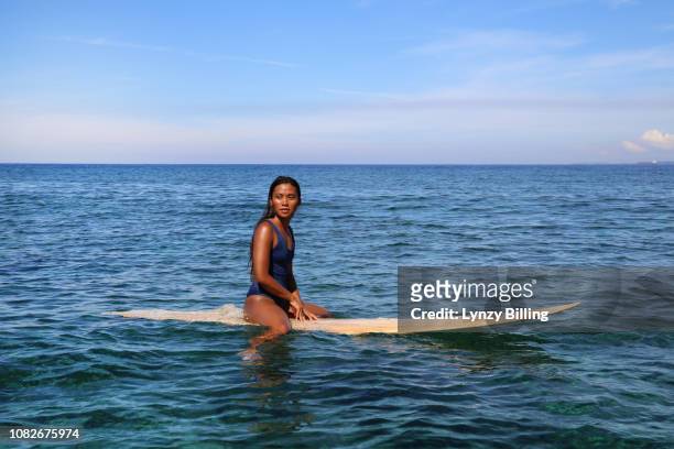 confident asian surfer woman - hot filipina women stock pictures, royalty-free photos & images