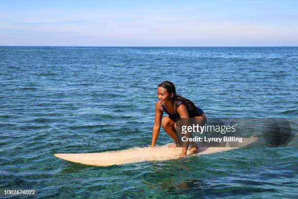 confident asian surfer woman - hot filipina women stock pictures, royalty-free photos & images