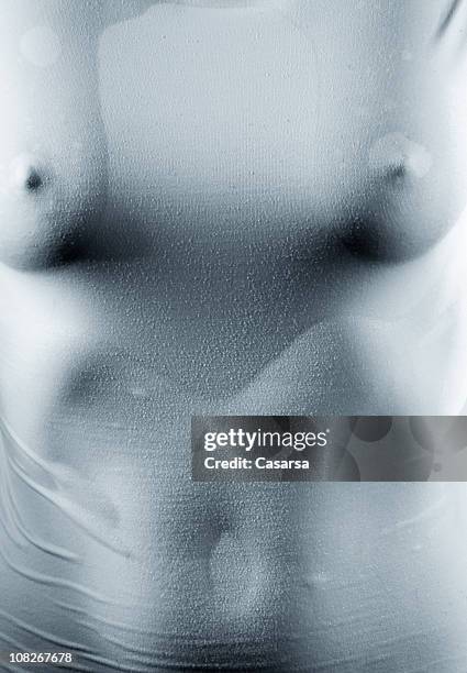 close-up of woman's body in wet shirt - women in wet tee shirts stock pictures, royalty-free photos & images