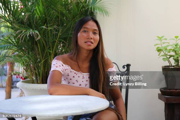 portrait of beauty confident dark skin asian woman sat outside - hot filipina women stock pictures, royalty-free photos & images