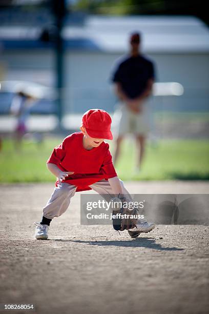 little boy playing baseball - grounder stock pictures, royalty-free photos & images