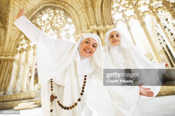 nuns dancing in old church cathedral - godsdienstige gebouwen stockfoto's en -beelden