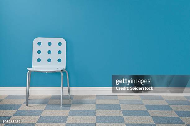 waiting room with one chair - linoleum stock pictures, royalty-free photos & images