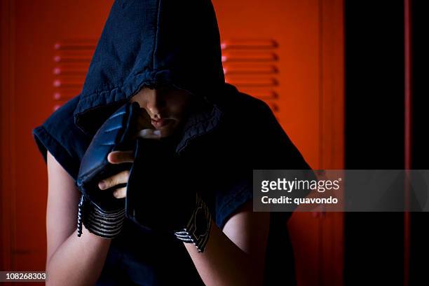 boxer young woman looking down, locker room, copy space - womens boxing 個照片及圖片檔