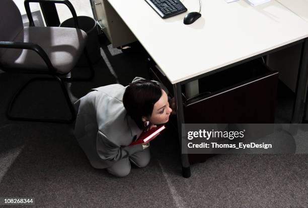 fear in the office - hiding stockfoto's en -beelden