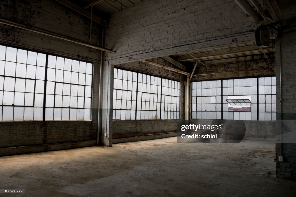 Empty, old, abandoned factory warehouse