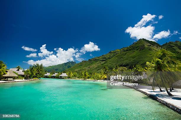tourist resort with ocean lagoon - tahiti stock pictures, royalty-free photos & images