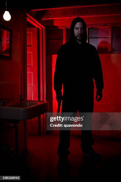 caucasian male intruder standing with knife - criminal offense stock pictures, royalty-free photos & images