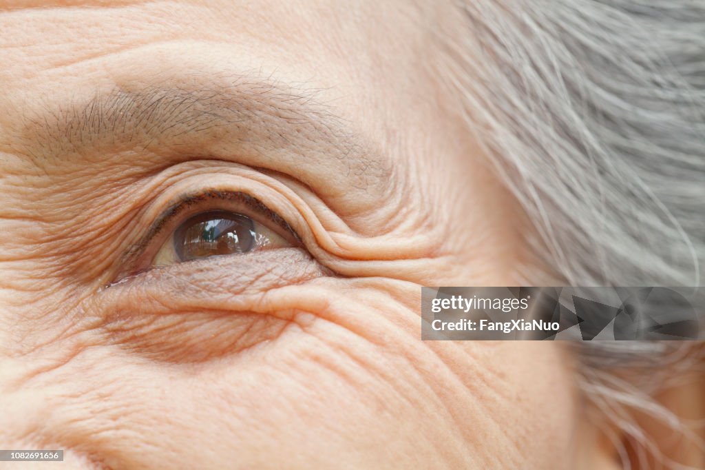 Close up of older Chinese woman's eye