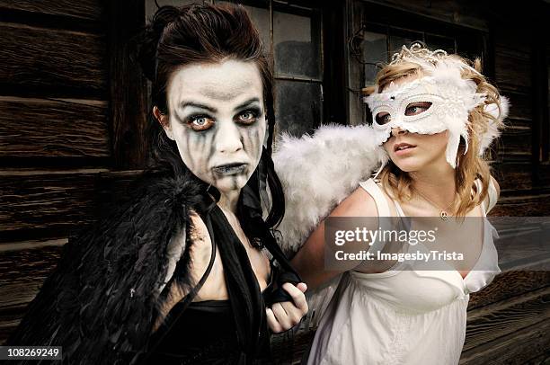 good and evil angels - dark angel stock pictures, royalty-free photos & images