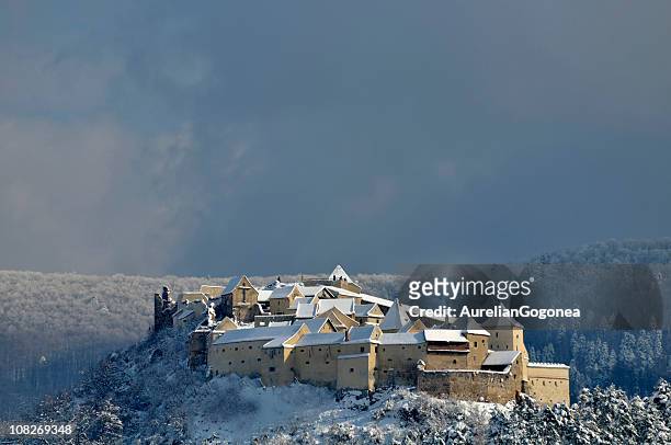 rasnov castle in romania covered with snow - romania stock pictures, royalty-free photos & images