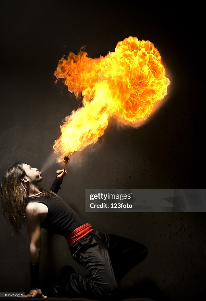 Male Acrobat Blowing Fire