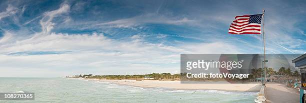 patriotic pier panorama gulf coast ocean beach florida usa - gulf coast states stock pictures, royalty-free photos & images