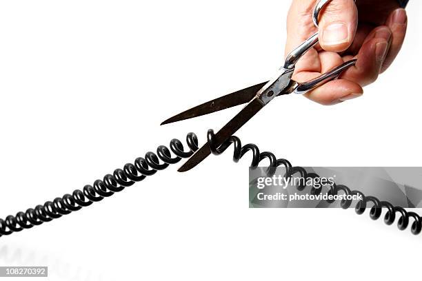hands using scissors to cut telephone wire - telephone line stock pictures, royalty-free photos & images