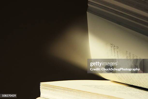 book page turning motion blur - closing book stock pictures, royalty-free photos & images