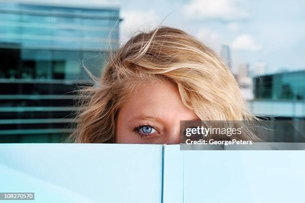 eyes reading book - mysterious blond woman stock pictures, royalty-free photos & images