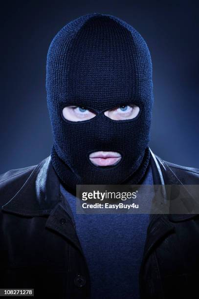 man wearing ski mask and staring - bank robber stock pictures, royalty-free photos & images