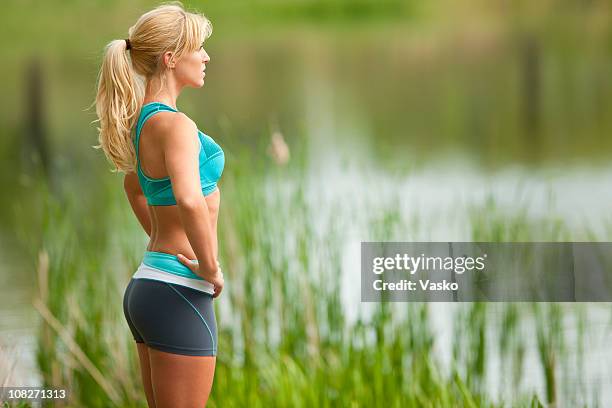 pensive jogger - women buttocks stock pictures, royalty-free photos & images