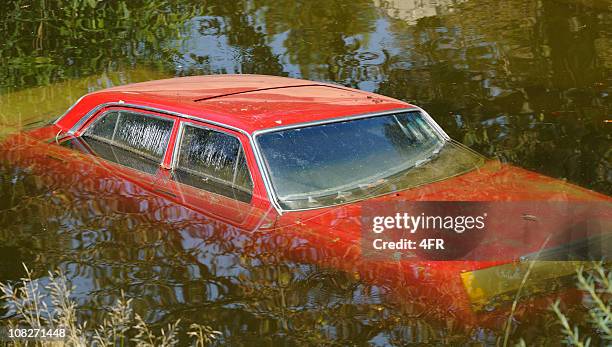 environmental change - car submerged and destroyed by flood - sunken car bildbanksfoton och bilder