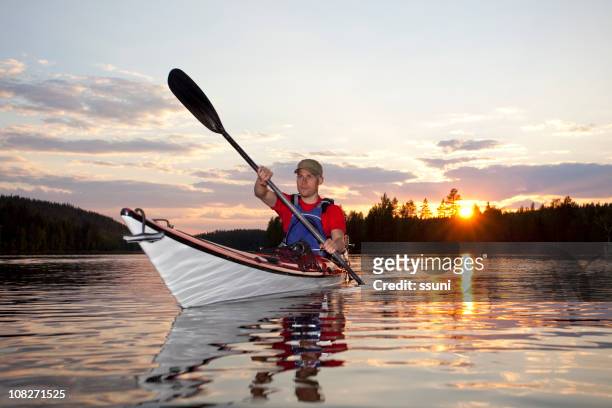 sunset kayaking - finland summer stock pictures, royalty-free photos & images