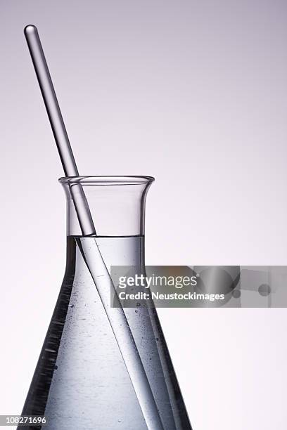 conical flask and stirrer dipped in it - volume fluid capacity stock pictures, royalty-free photos & images