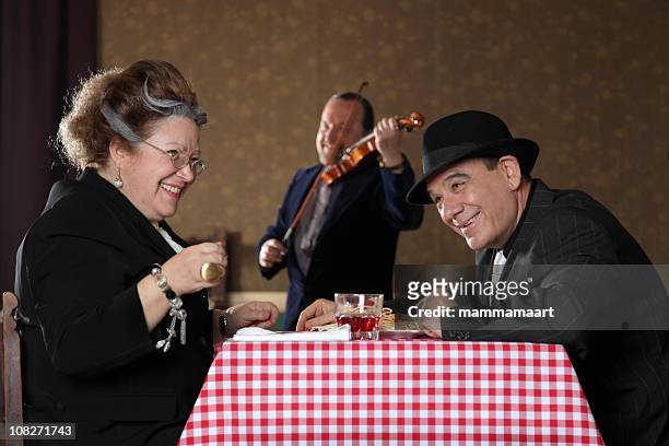romantic laughing gangster couple - female gangster stock pictures, royalty-free photos & images