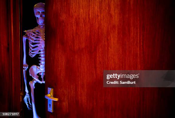 skeleton in the cupboard - funny skeleton stockfoto's en -beelden