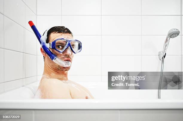 bathtub diver - scuba mask stock pictures, royalty-free photos & images