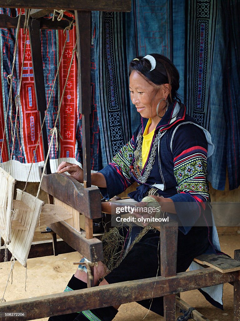 Traditional Lady Operating Weaving Loom