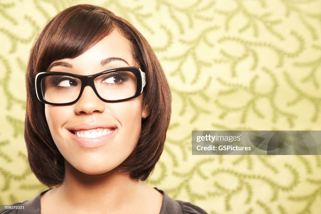 Close-up of a beautiful woman with glasses looking sideways