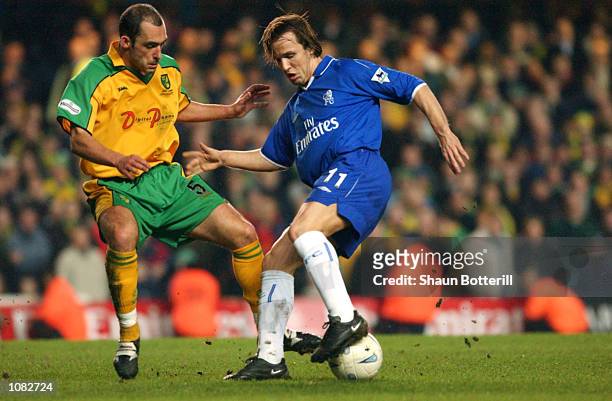Boudewijn Zenden of Chelsea turns with the ball against Craig Fleming of Norwich City during the AXA sponsored FA Cup third round replay match played...