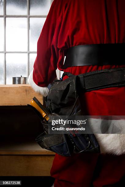 back of santa claus making toys in workshop, copy space - santas workshop stock pictures, royalty-free photos & images